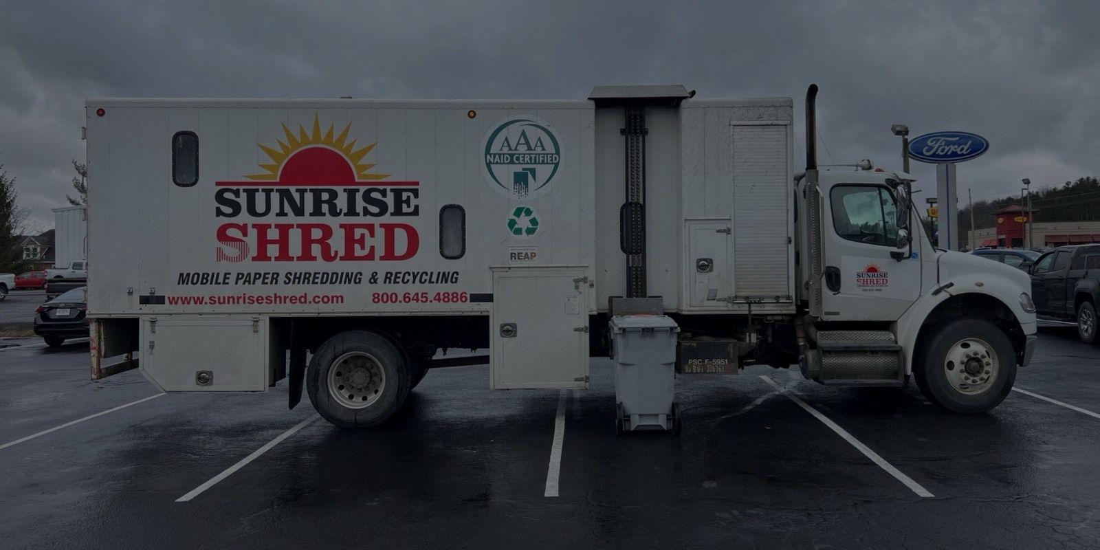 Sunrise Shred mobile shredding truck with a secure shred bin